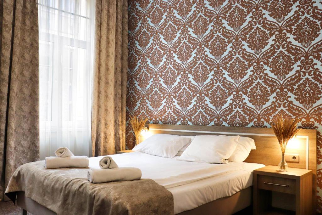 Posteľ alebo postele v izbe v ubytovaní Hotel Lothus