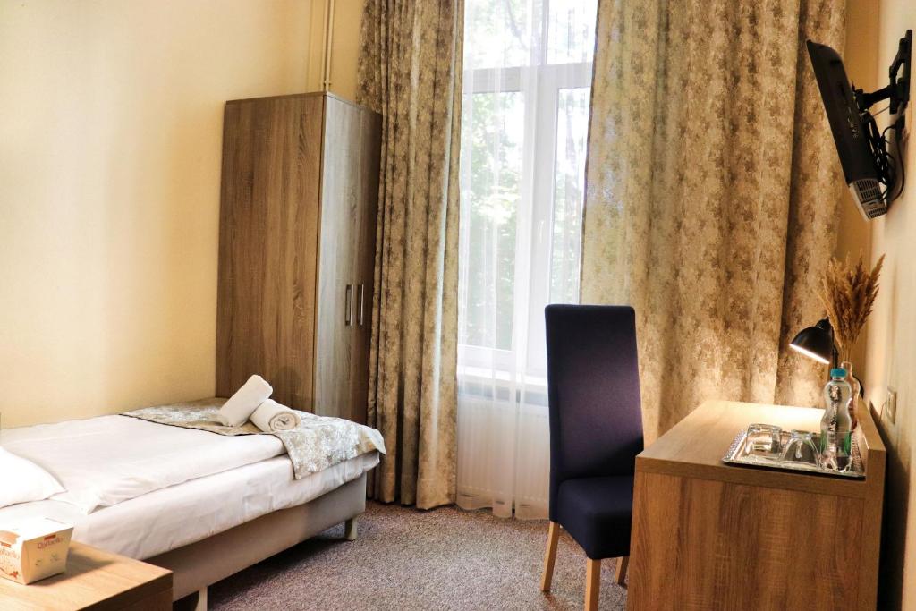 Posteľ alebo postele v izbe v ubytovaní Hotel Lothus