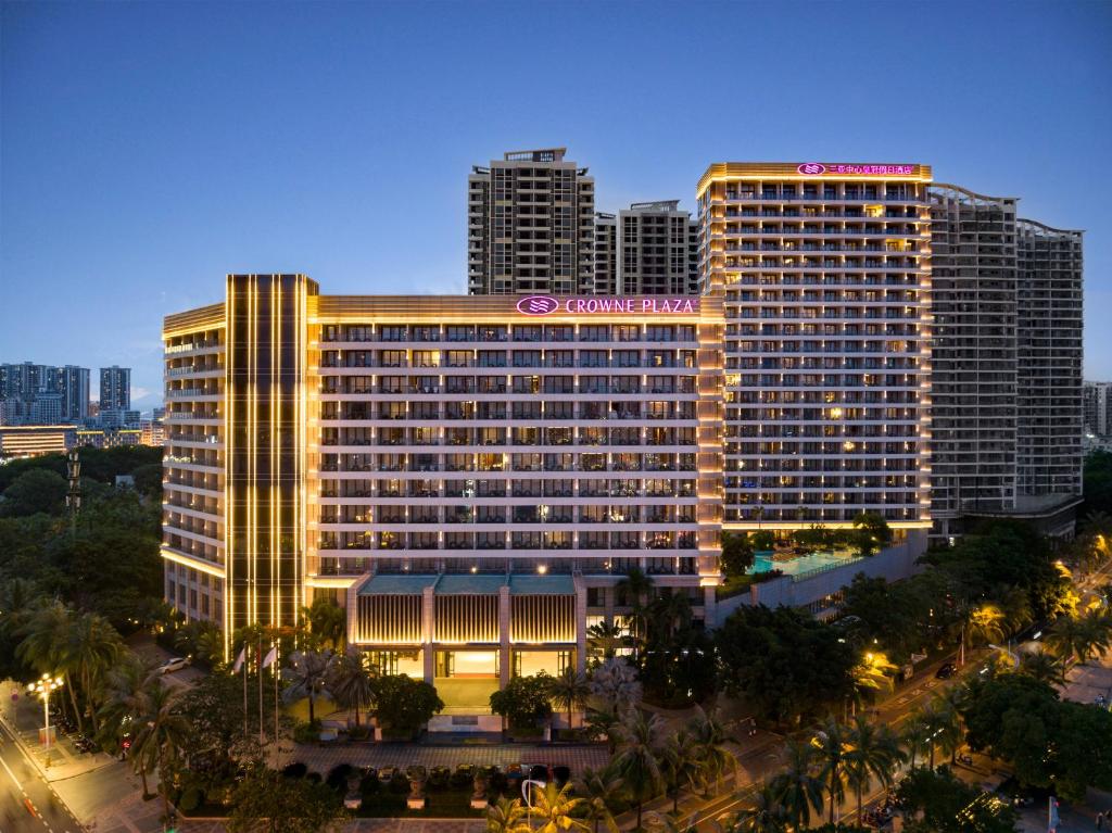 a large hotel building with a sign on it at Crowne Plaza Sanya City Center by IHG in Sanya