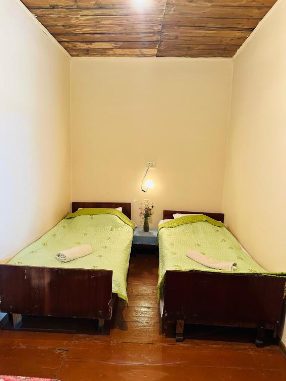 Postel nebo postele na pokoji v ubytování Tamazi guest house