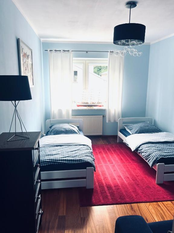 Łóżko lub łóżka w pokoju w obiekcie Sopot Family Place