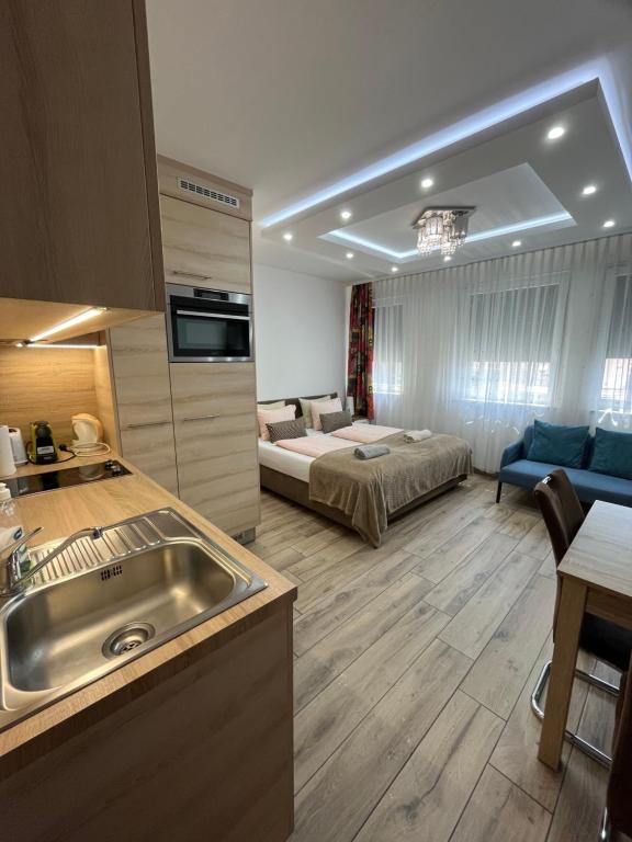 Posteľ alebo postele v izbe v ubytovaní Elite Green Apartments