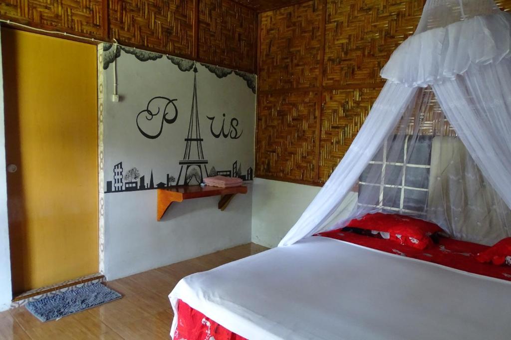 Postel nebo postele na pokoji v ubytování Asim Paris Guesthouse & jungle trekking