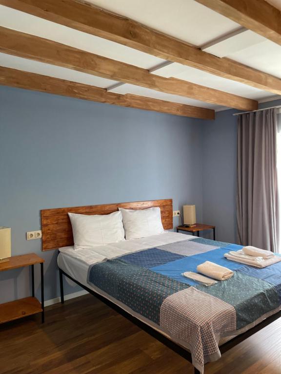 Postel nebo postele na pokoji v ubytování Hotel Ailama Mestia
