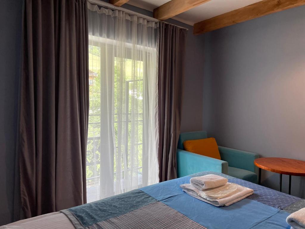 Postel nebo postele na pokoji v ubytování Hotel Ailama Mestia