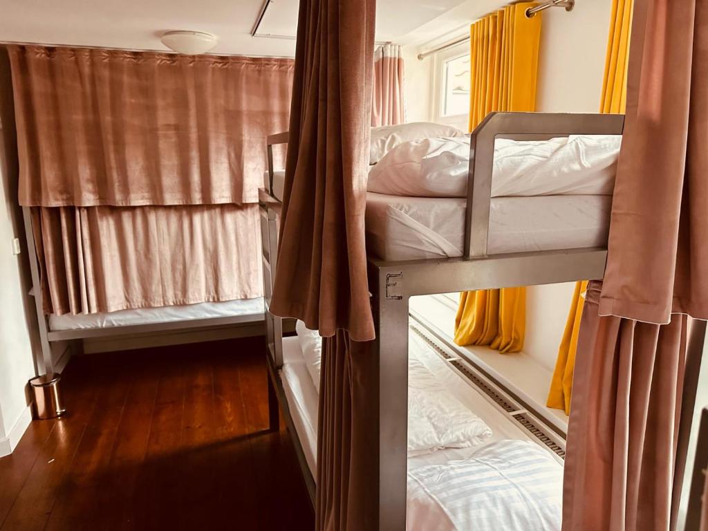 a couple of bunk beds in a room at Space Hostel Amsterdam Zaandam in Zaandam