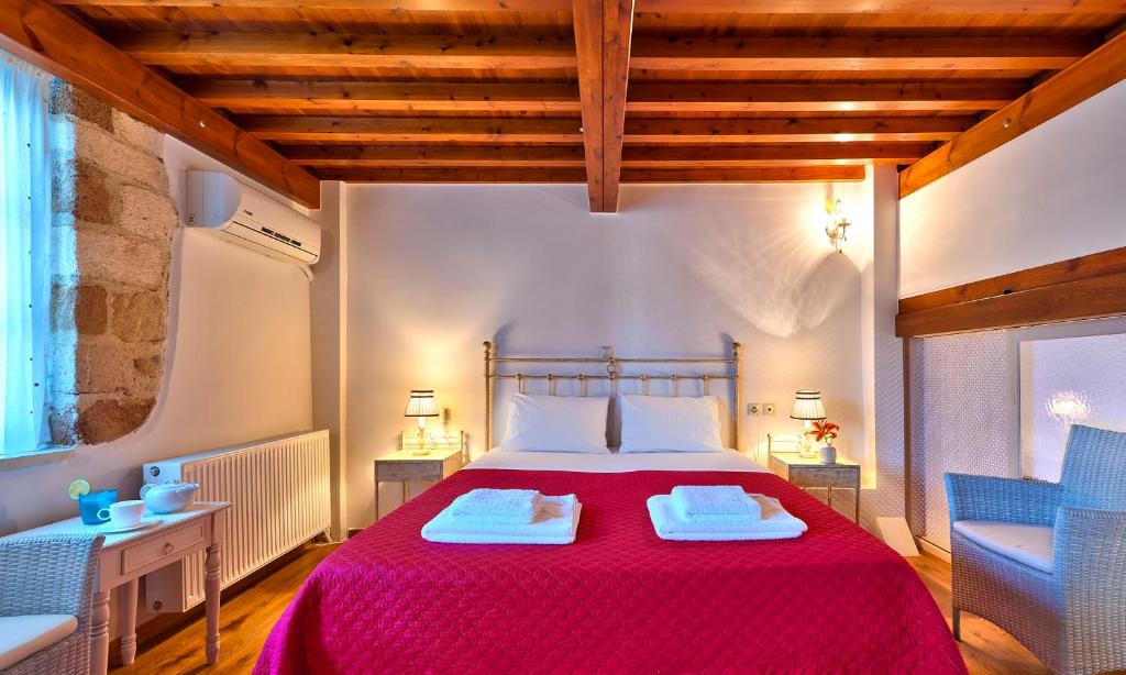 Posteľ alebo postele v izbe v ubytovaní Kores Boutique Houses
