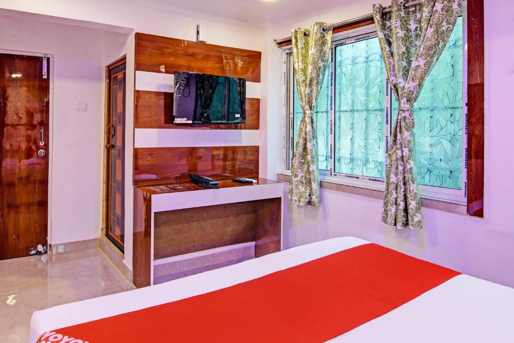 Postel nebo postele na pokoji v ubytování Hotel O Golden Palace