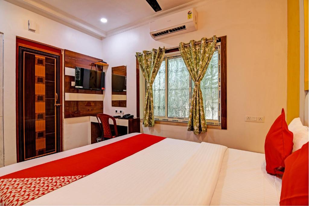 Postel nebo postele na pokoji v ubytování Hotel O Golden Palace