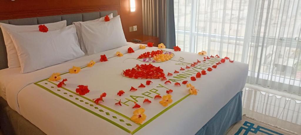 Postel nebo postele na pokoji v ubytování Salalah International Hotel