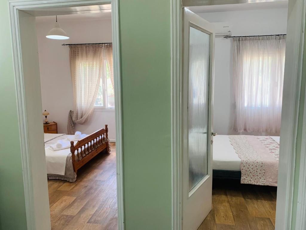 Postel nebo postele na pokoji v ubytování Villa Thea