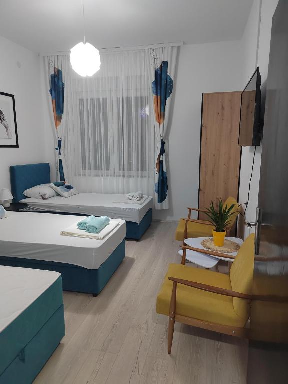 Postel nebo postele na pokoji v ubytování Jes Apartments