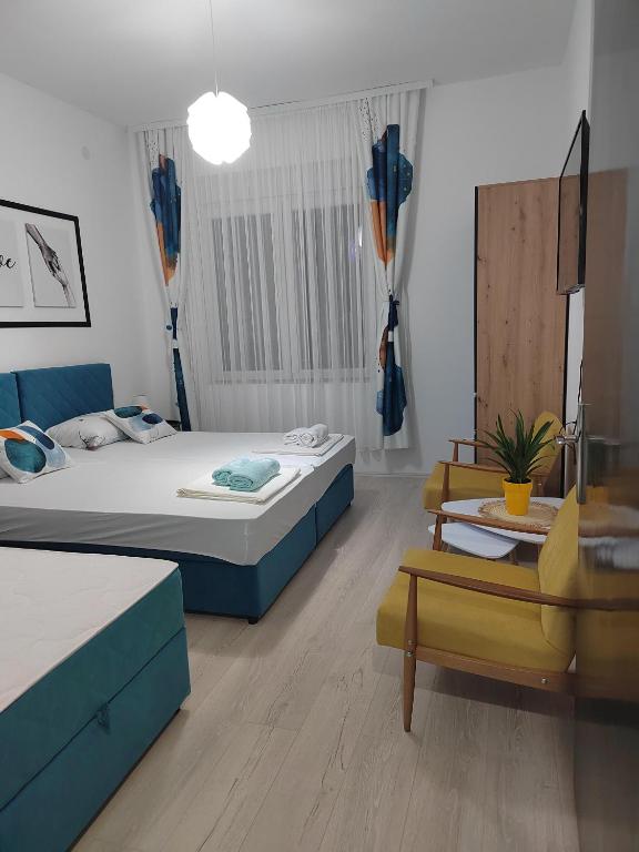Postel nebo postele na pokoji v ubytování Jes Apartments