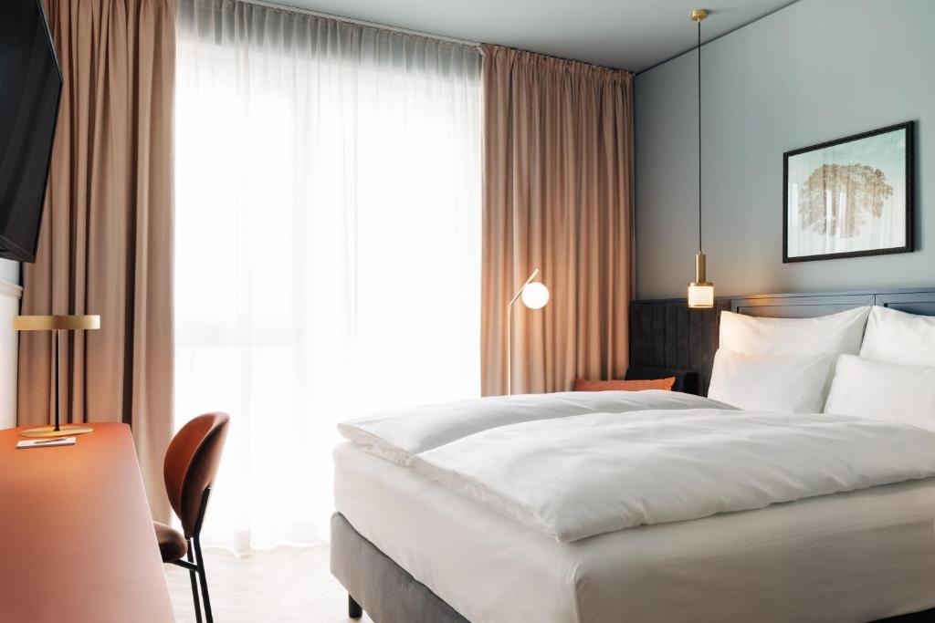Postel nebo postele na pokoji v ubytování Hotel Galántha