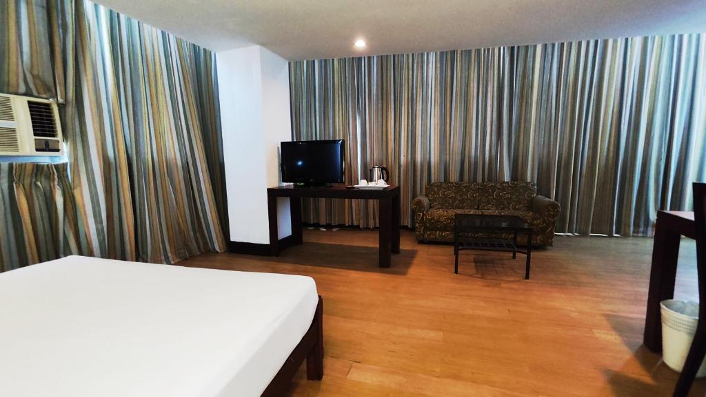 TV a/nebo společenská místnost v ubytování Rajah Park Hotel by Hiverooms