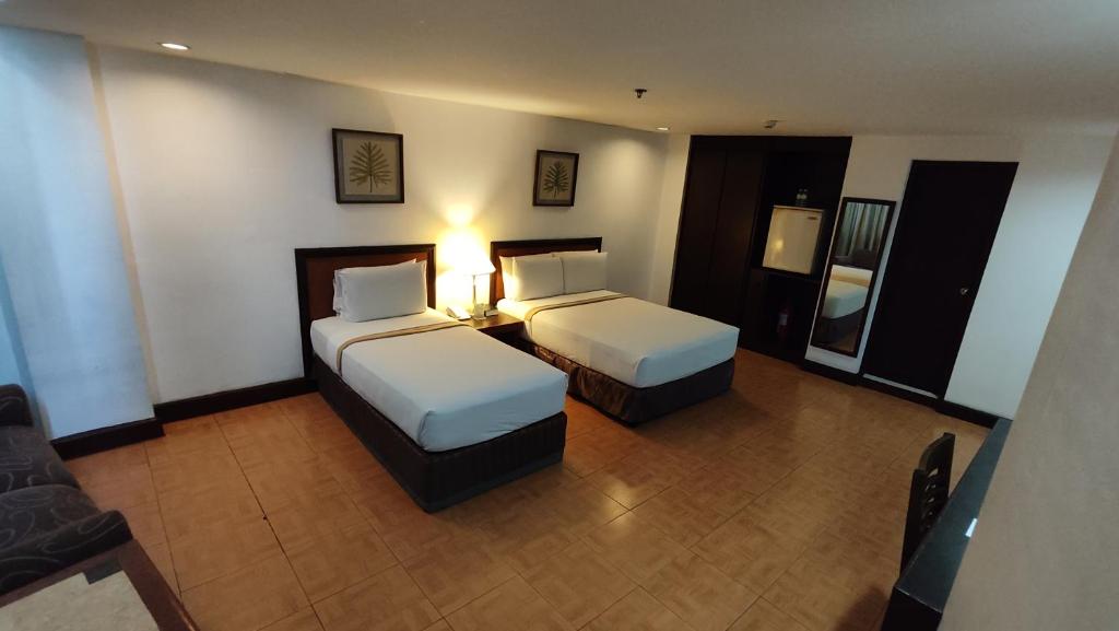 Postel nebo postele na pokoji v ubytování Rajah Park Hotel by Hiverooms