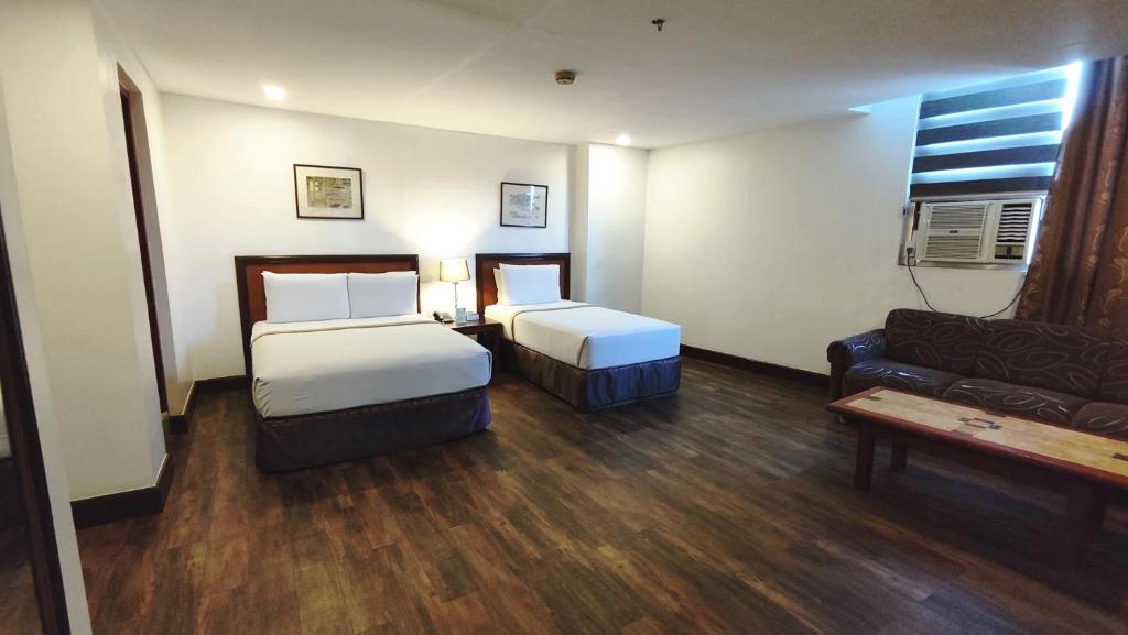 Postel nebo postele na pokoji v ubytování Rajah Park Hotel by Hiverooms