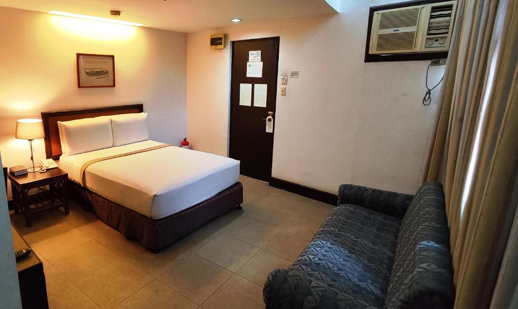 Postel nebo postele na pokoji v ubytování Rajah Park Hotel by Hiverooms