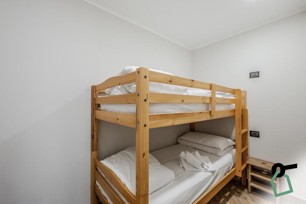 Postel nebo postele na pokoji v ubytování Hotiday Room Collection - Sauze Assietta