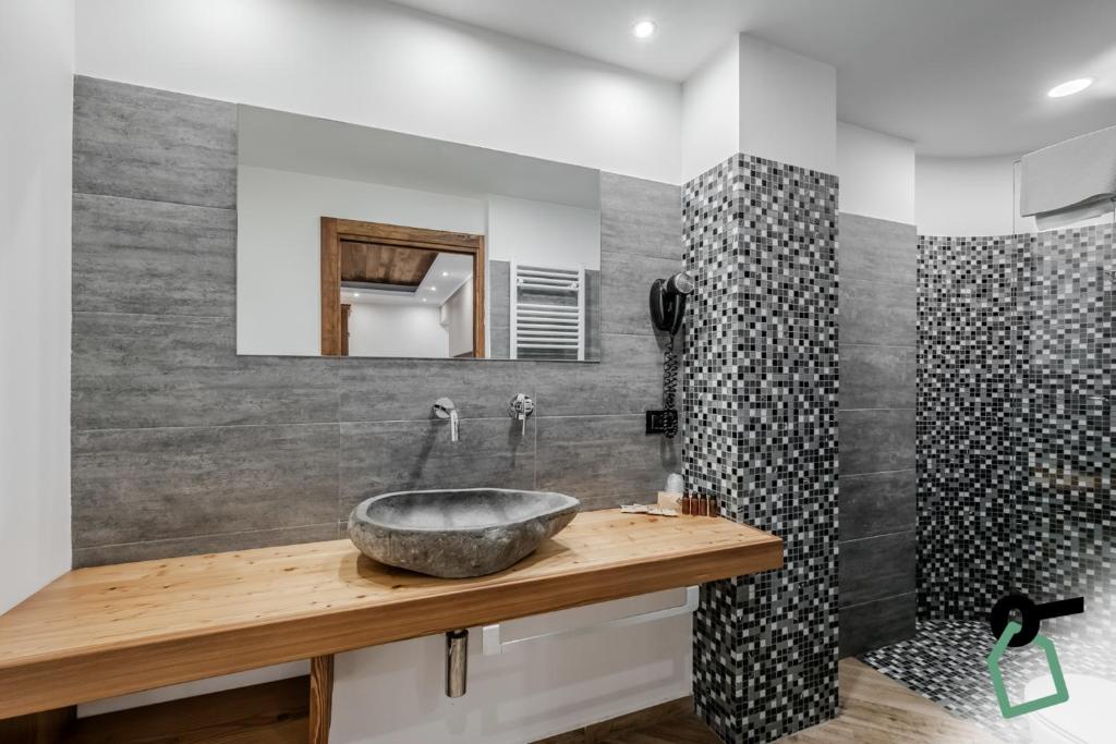 Koupelna v ubytování Hotiday Room Collection - Sauze Assietta