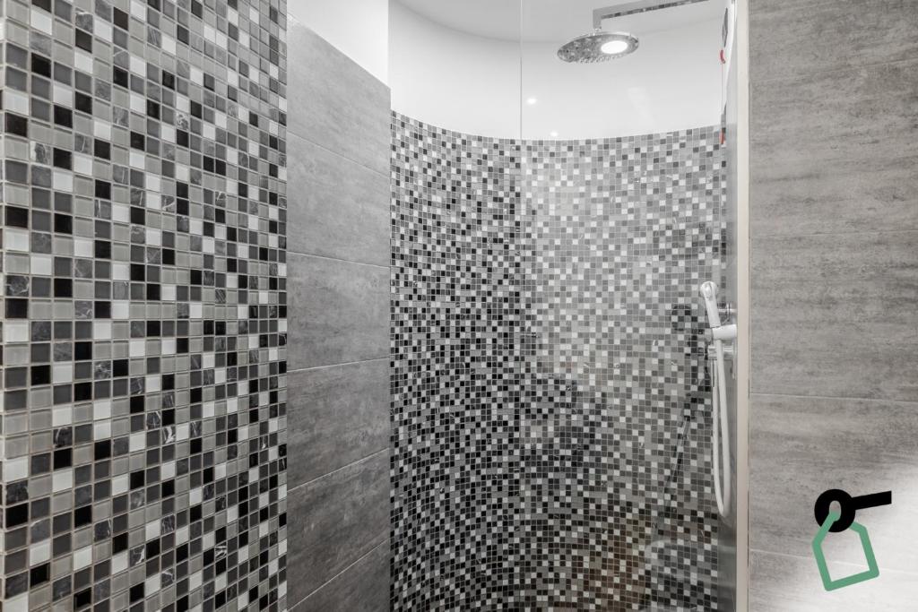 Koupelna v ubytování Hotiday Room Collection - Sauze Assietta