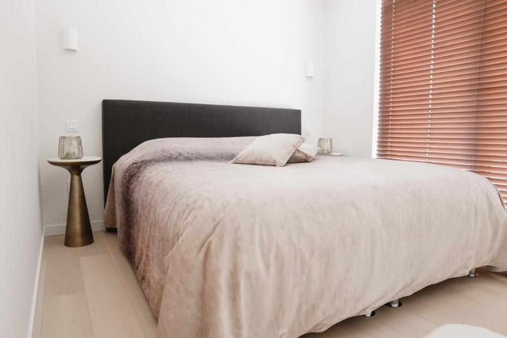 Postel nebo postele na pokoji v ubytování Brand New Apartment Sint-niklaas