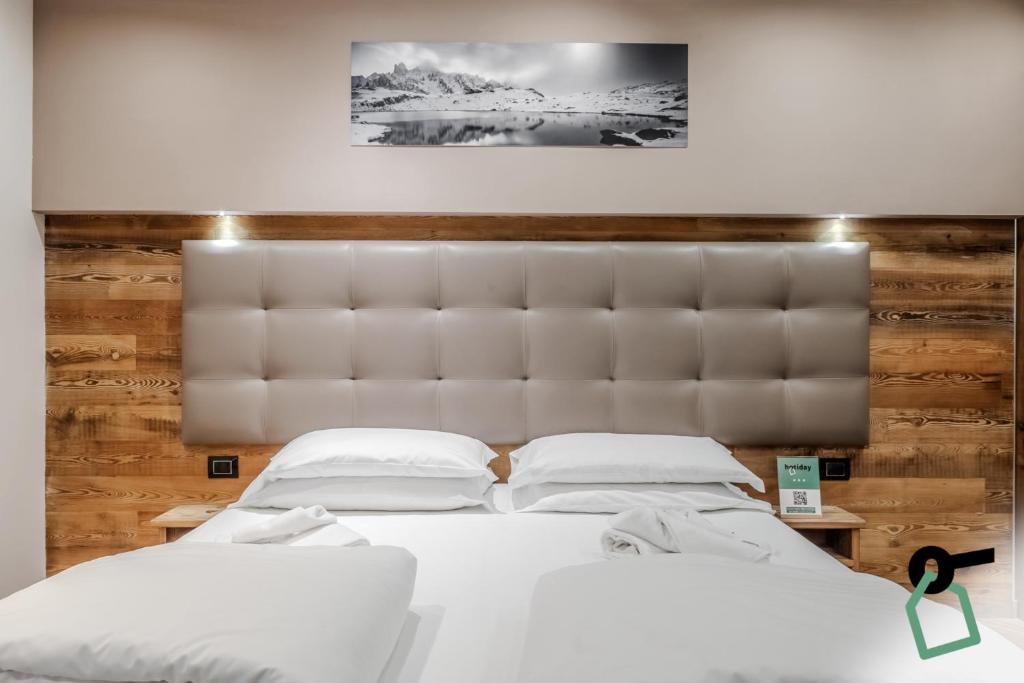 Postel nebo postele na pokoji v ubytování Hotiday Room Collection - Sauze Assietta