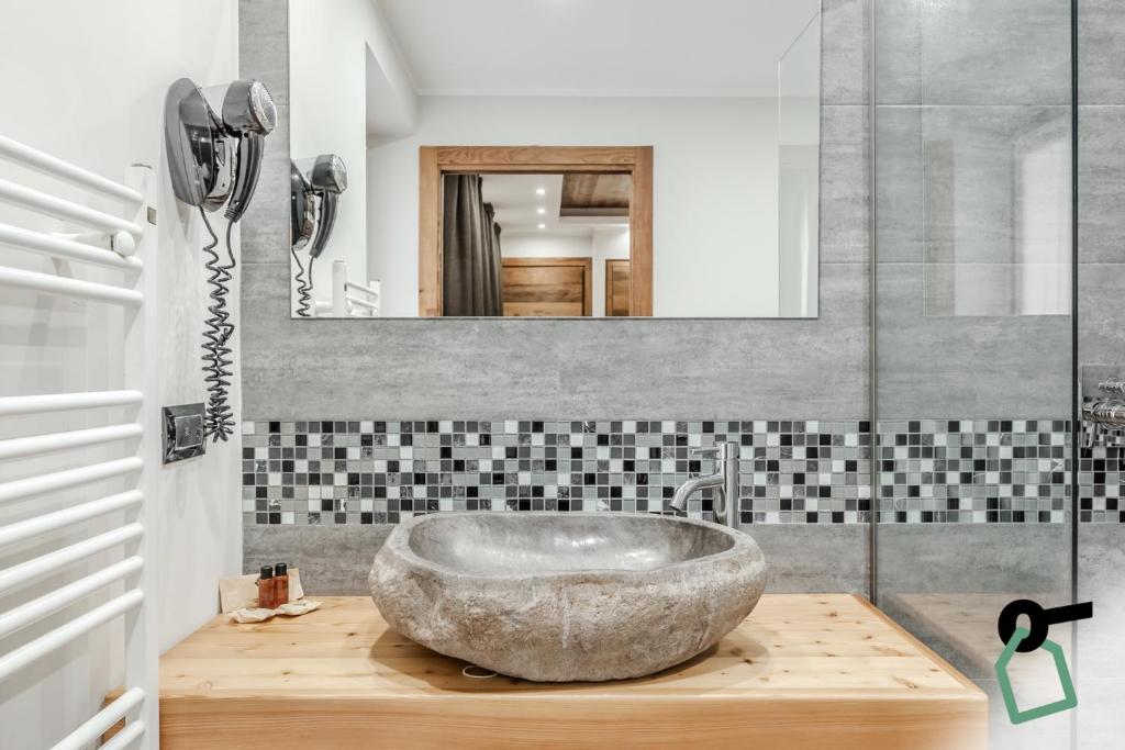 Koupelna v ubytování Hotiday Room Collection - Sauze Assietta