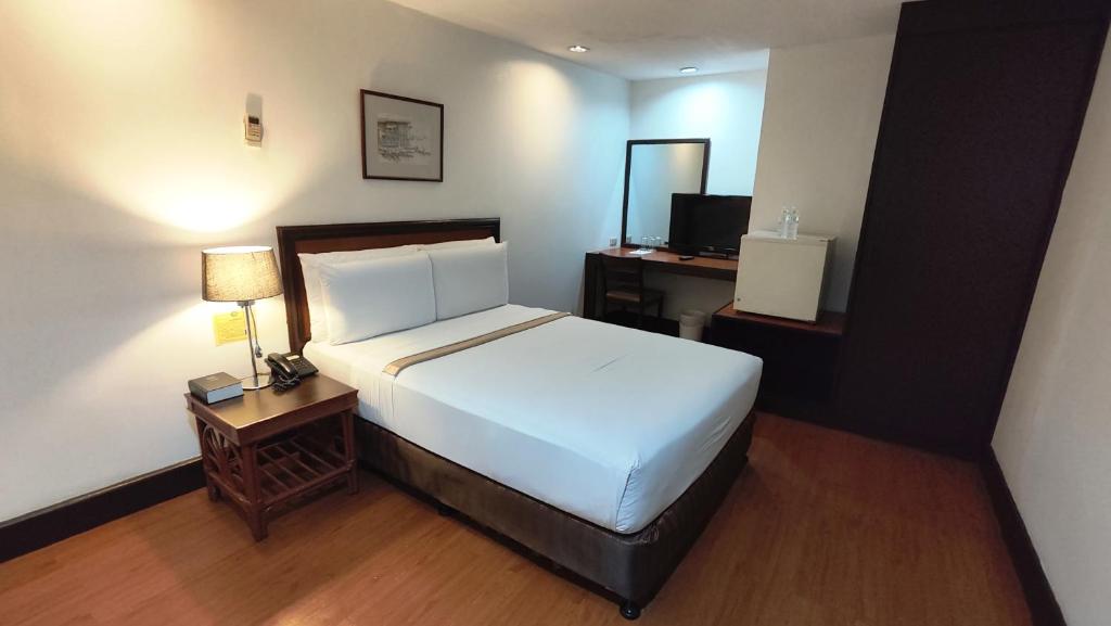 Postel nebo postele na pokoji v ubytování Rajah Park Hotel by Hiverooms