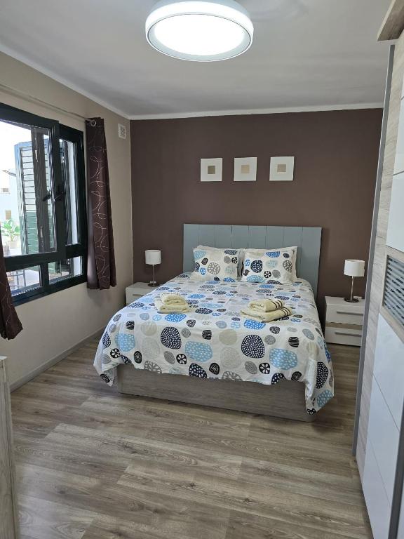 Posteľ alebo postele v izbe v ubytovaní Bungalow Naïla