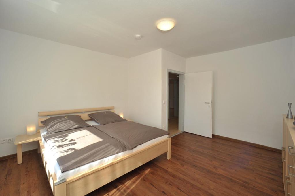 Postel nebo postele na pokoji v ubytování Ferienwohnung Refugium