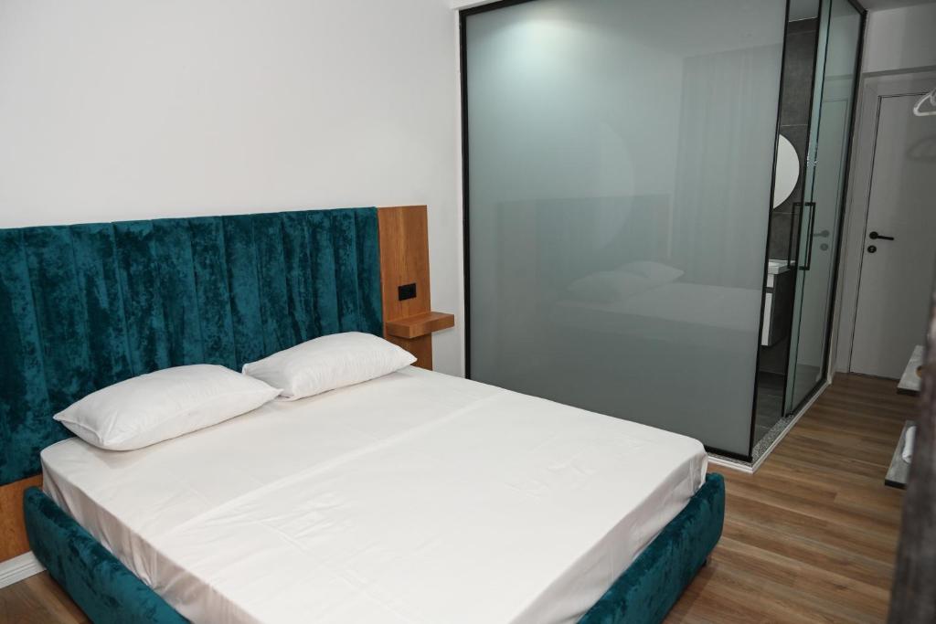 Postel nebo postele na pokoji v ubytování Apollonia Hotel