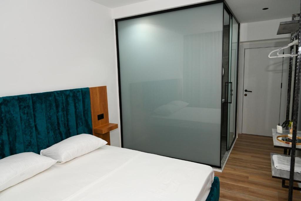 Postel nebo postele na pokoji v ubytování Apollonia Hotel