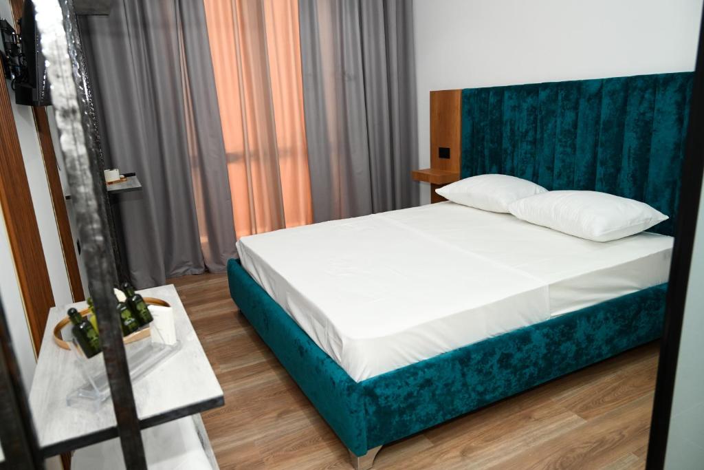 Postel nebo postele na pokoji v ubytování Apollonia Hotel