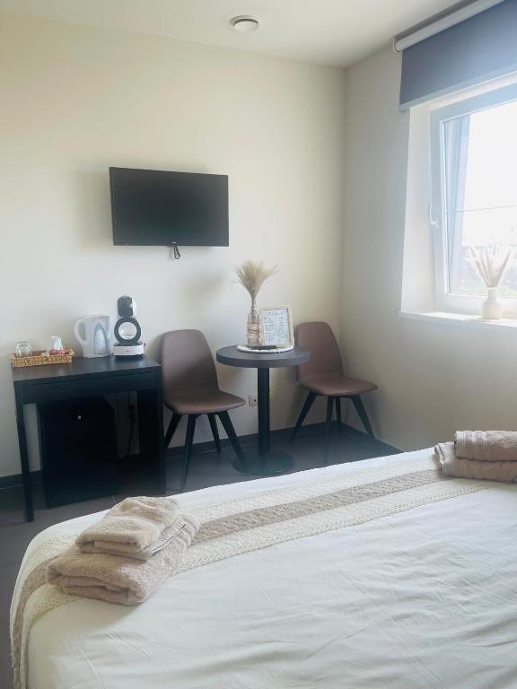 Postel nebo postele na pokoji v ubytování Equus B&B