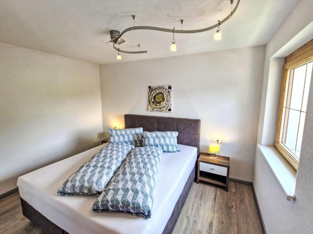 A bed or beds in a room at Holiday Home Heidi by Interhome