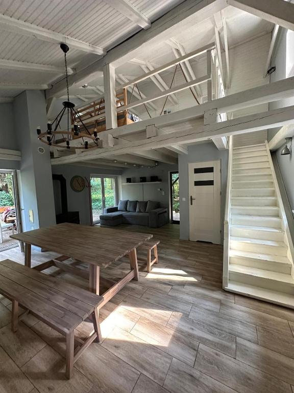 a large living room with a table and a couch at Lawenda in Turawa