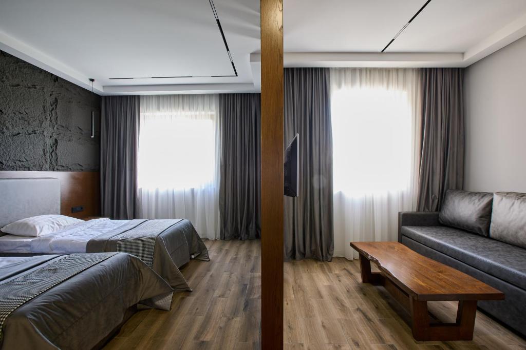 Postel nebo postele na pokoji v ubytování Noy Land Resort