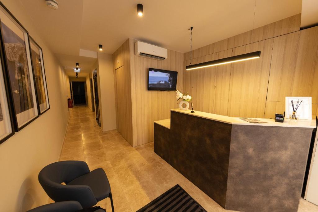 TV a/nebo společenská místnost v ubytování East Sliema Suites