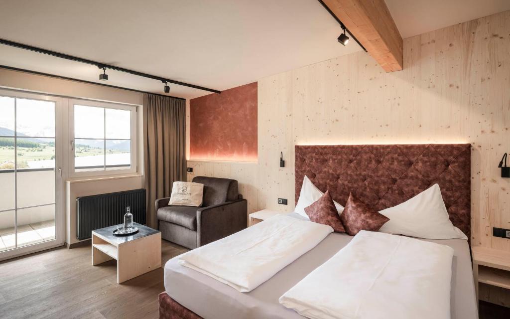 Łóżko lub łóżka w pokoju w obiekcie Vital Hotel Ortlerspitz