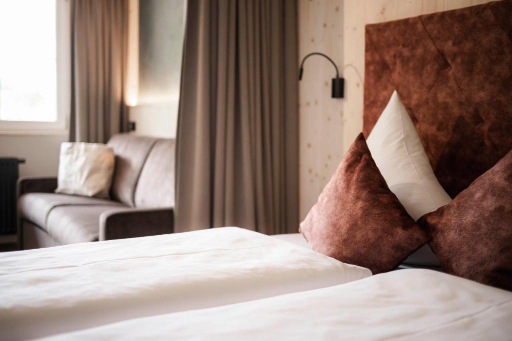 Łóżko lub łóżka w pokoju w obiekcie Vital Hotel Ortlerspitz