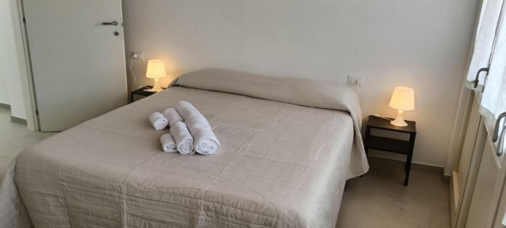 Postel nebo postele na pokoji v ubytování CalYpso 1 - Franciacorta Love