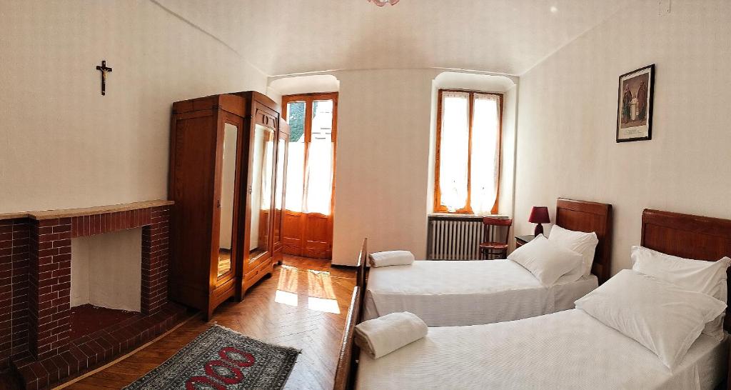 Postel nebo postele na pokoji v ubytování Casa dell'Angelo custode