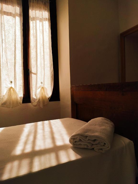 Postel nebo postele na pokoji v ubytování Casa dell'Angelo custode