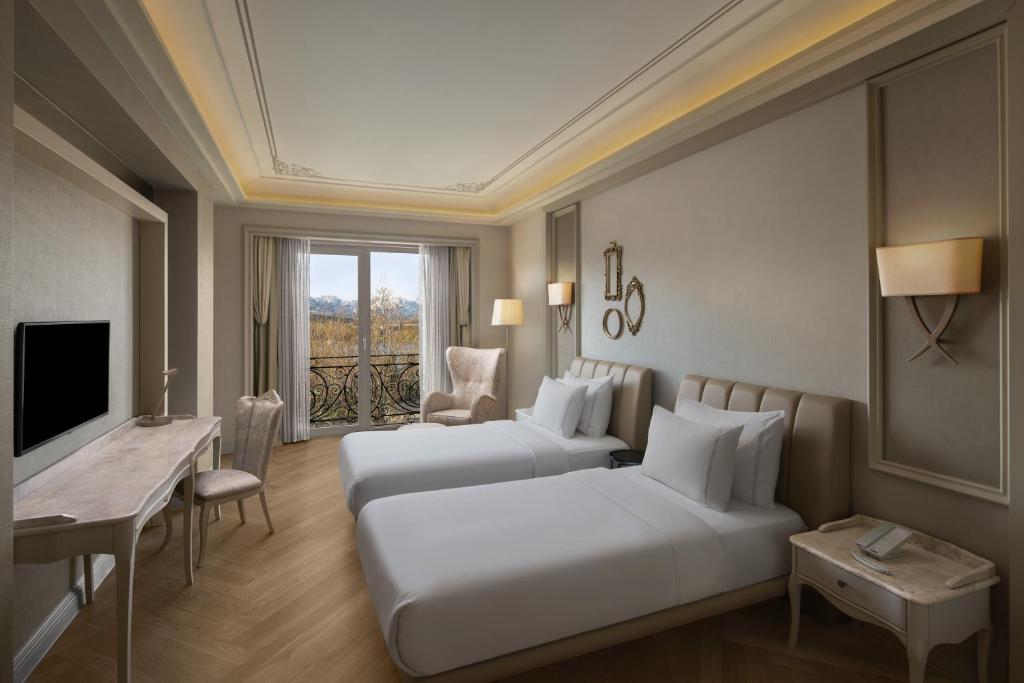 Rúm í herbergi á Lazzoni Hotel