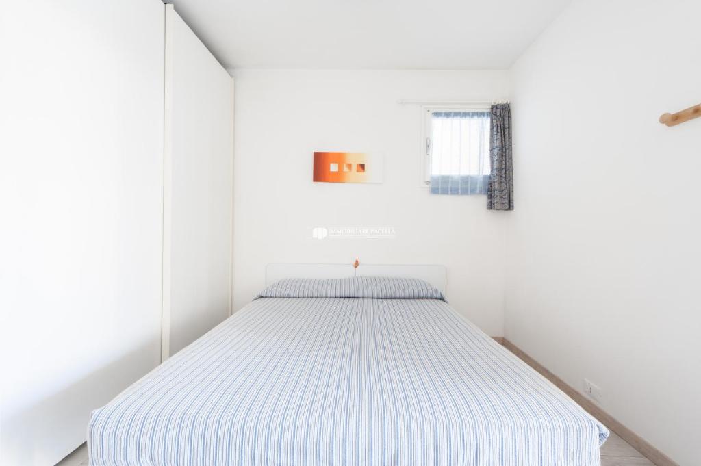Posteľ alebo postele v izbe v ubytovaní Residence Santa Fè Immobiliare Pacella