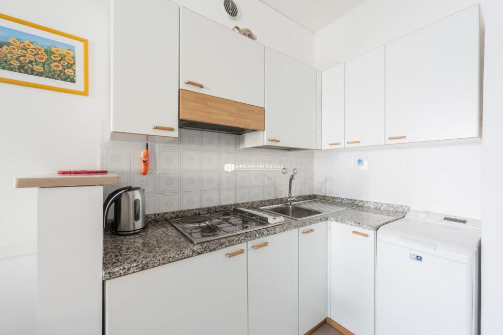 Kuchyňa alebo kuchynka v ubytovaní Residence Santa Fè Immobiliare Pacella