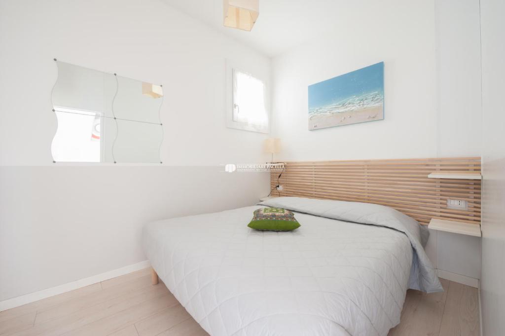 Posteľ alebo postele v izbe v ubytovaní Residence Santa Fè Immobiliare Pacella