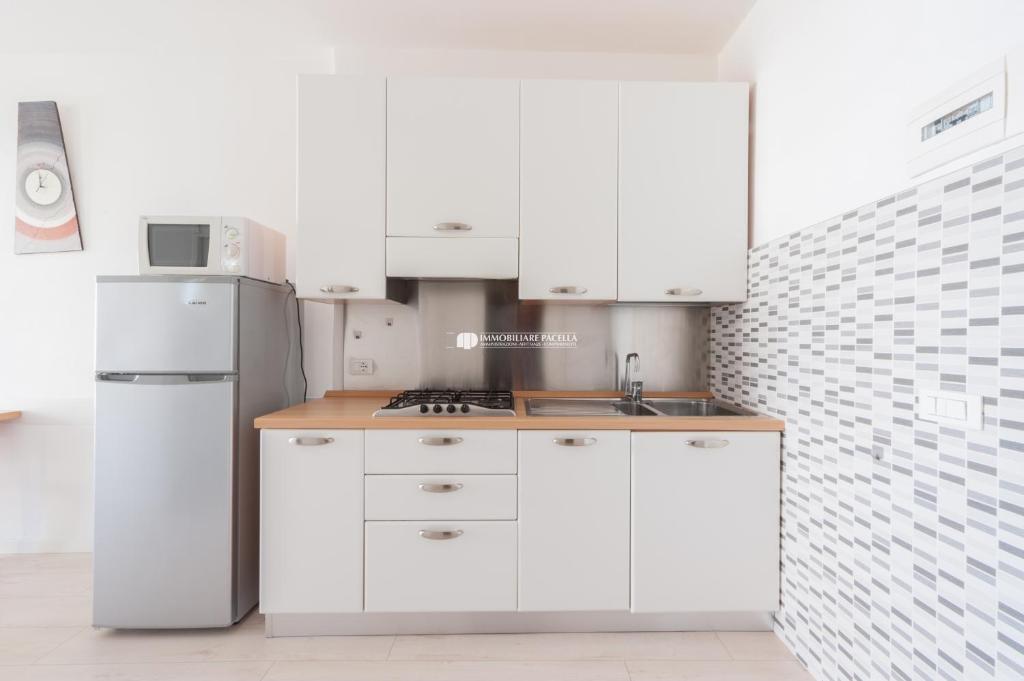 Kuchyňa alebo kuchynka v ubytovaní Residence Santa Fè Immobiliare Pacella
