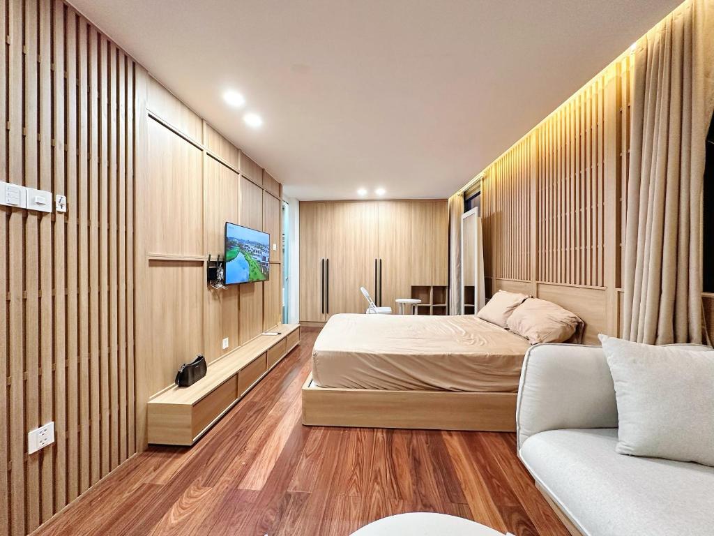 Postel nebo postele na pokoji v ubytování HOD Apartment Tan Dinh